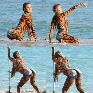 Cardi B launches a competition to find the world's best twerker as she dances in tiger body paint for raunchy new music video